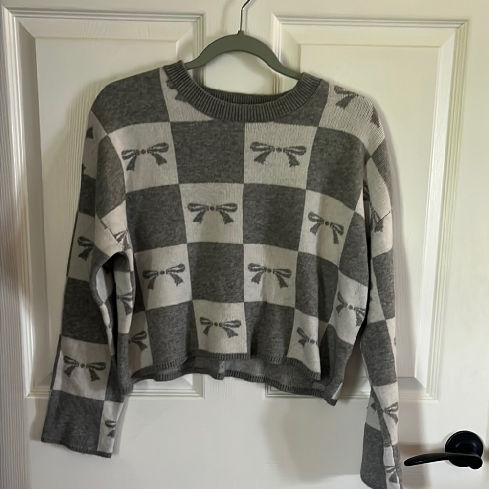 Gray and White Checkered Sweater with Bow Pattern